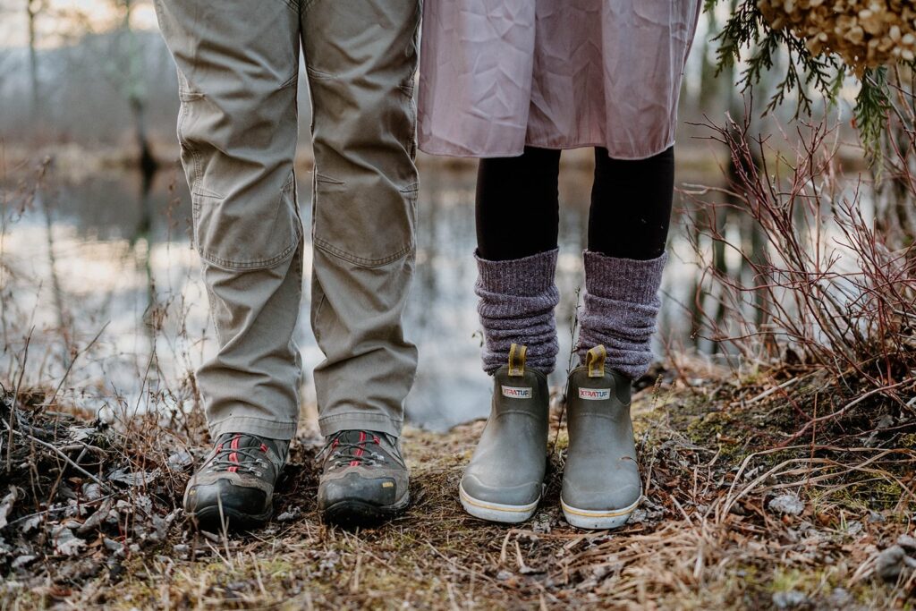two pairs of feet wearing mud boots during intimate vermont elopement