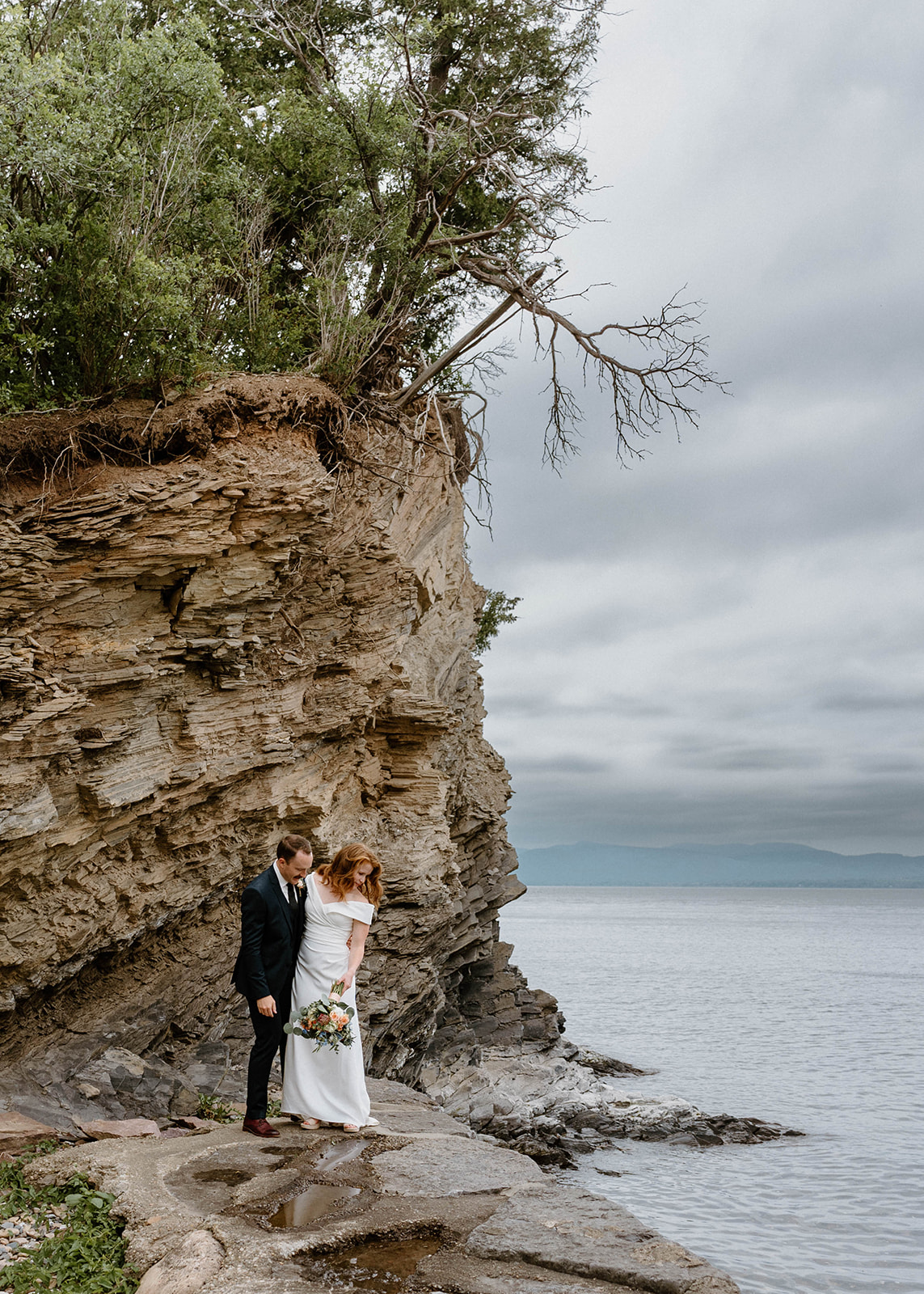 bride and groom on beach after elopement ceremony at Shelburne Farms in Vermont