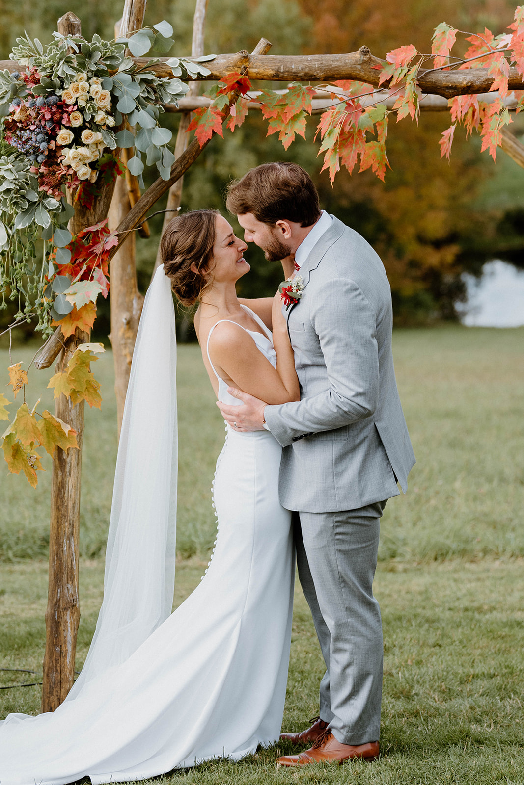 bride and groom kissing at elopement ceremony at Bliss Ridge Farm in Moretown, Vermont